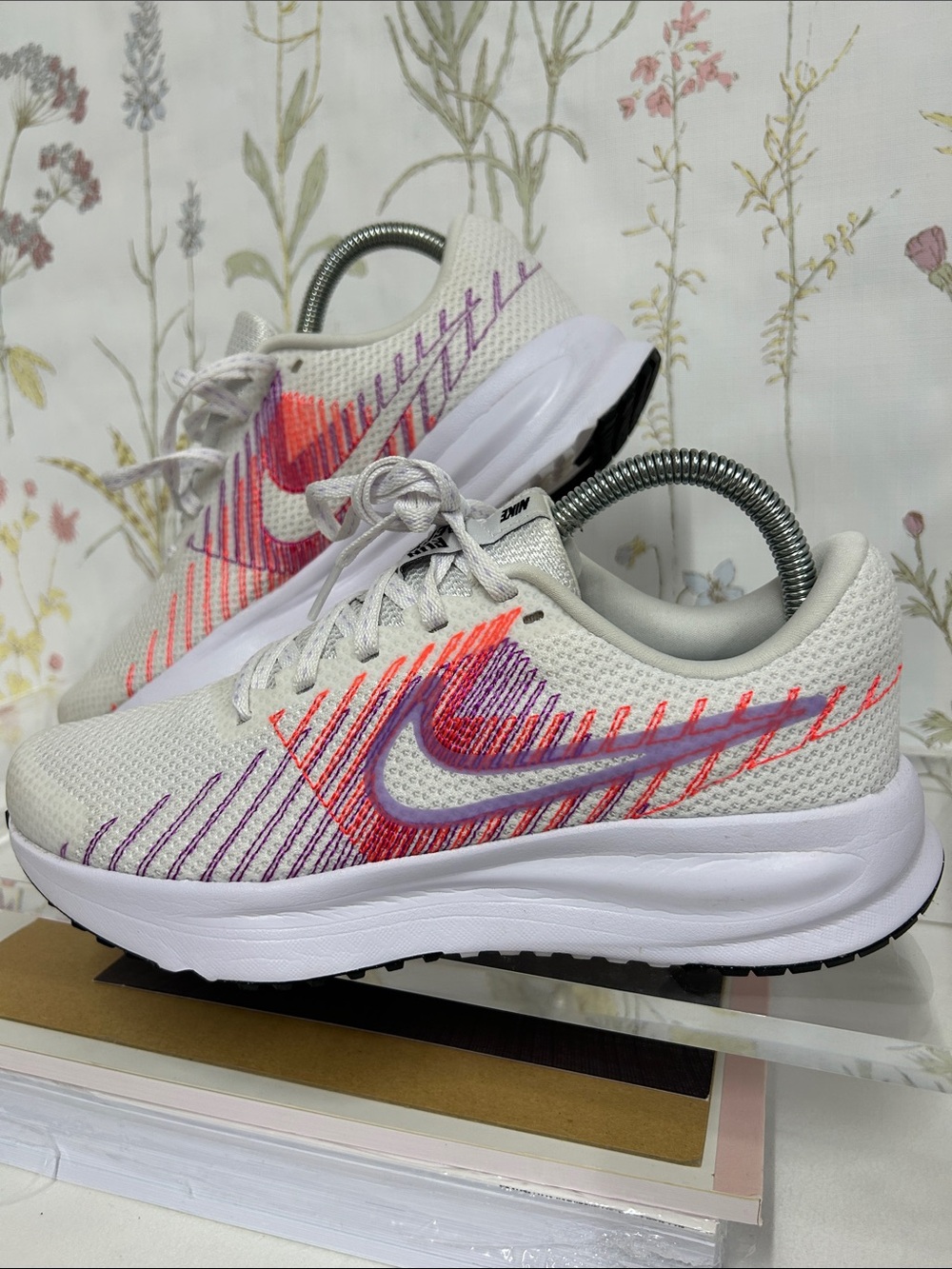 Nike Women's Run Defy White Running Shoes with Pink & Purple Stitch Detailing
